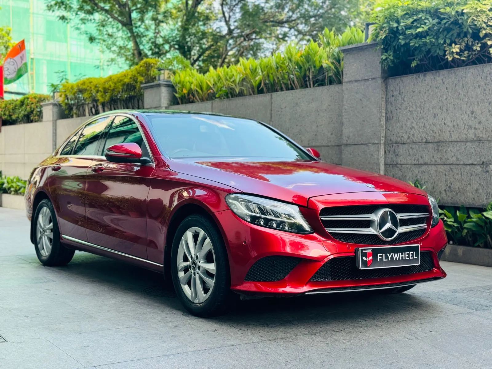 Exterior view of a sleek, high-end sedan parked elegantly in a showroom setting.