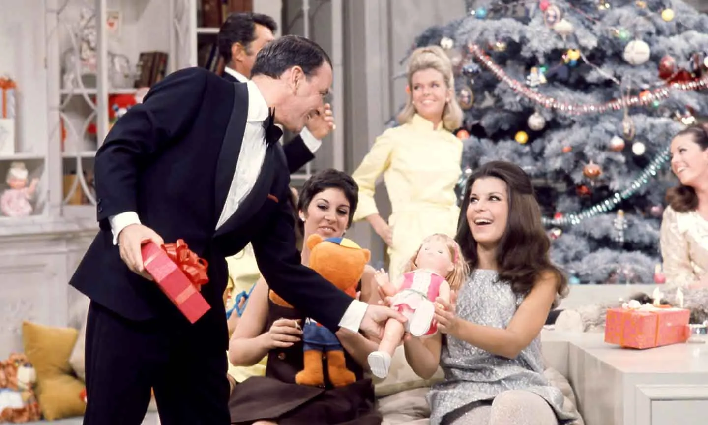 Frank Sinatra, a Hollywood star and beloved entertainer, smiling during a performance.
