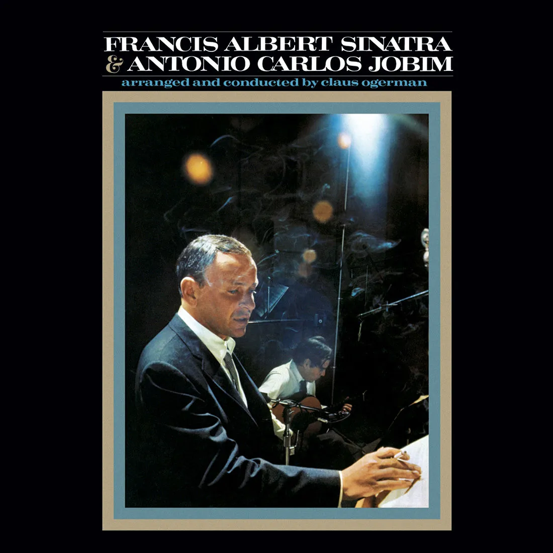 Frank Sinatra singing into a microphone