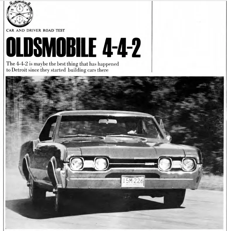 Front side view of a classic 1967 Oldsmobile 442 in a vibrant color