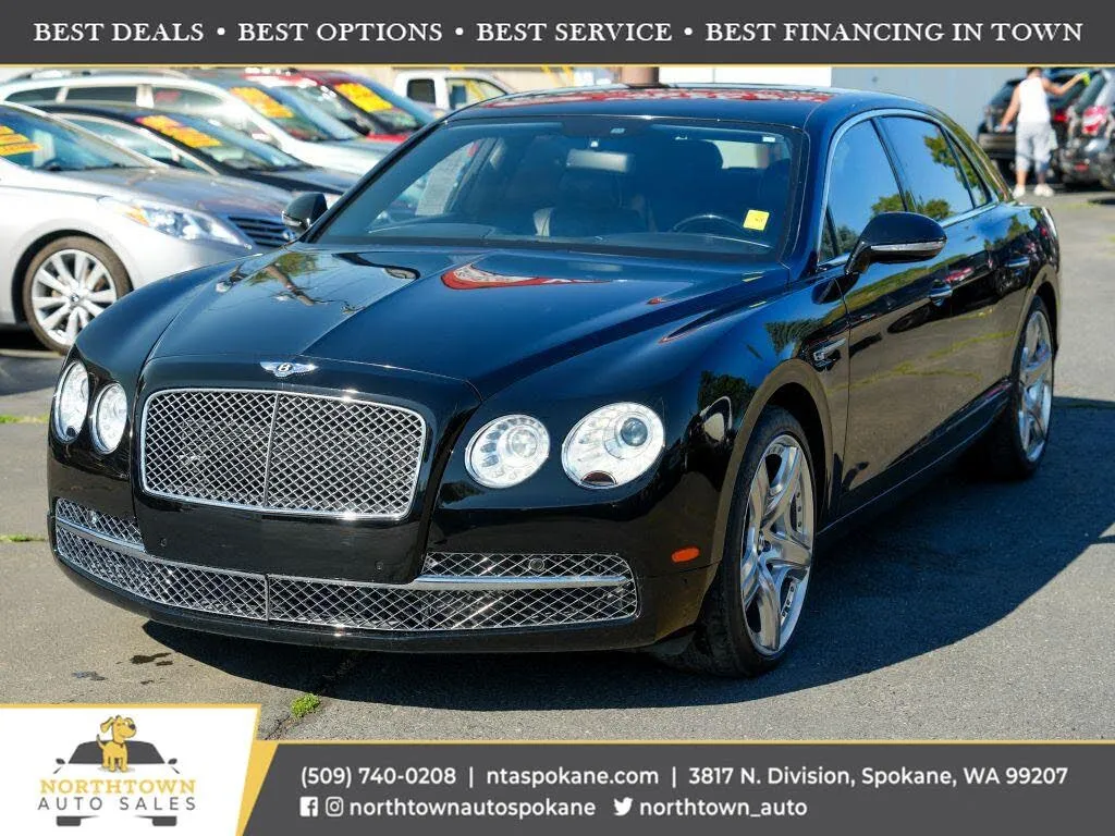 Front three-quarter view of a black 2015 Bentley Flying Spur W12