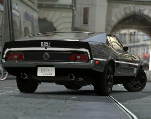 Front three-quarter view of a red 1971 Ford Mustang Mach 1 with a black hood stripe