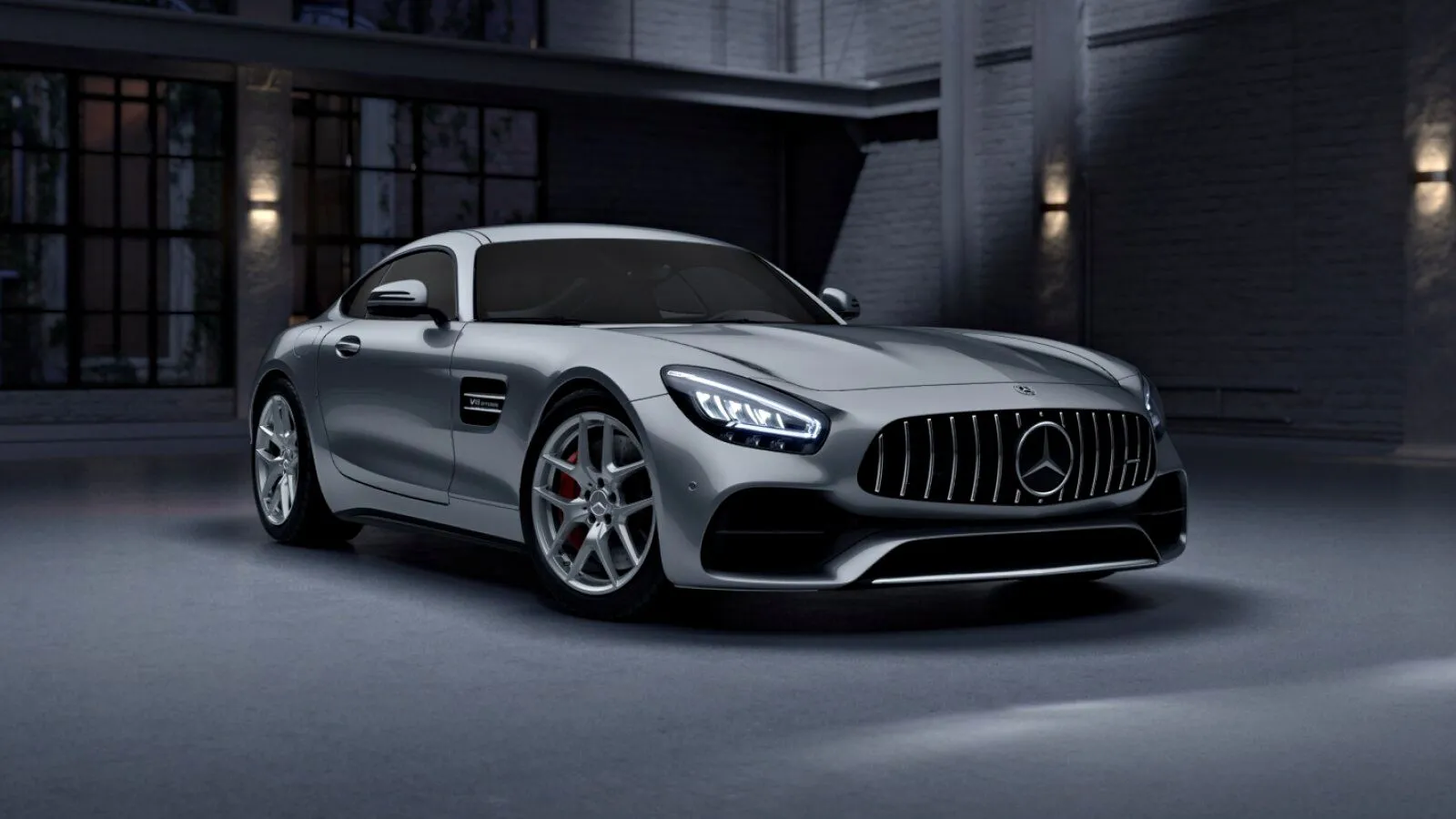 Front three-quarter view of a silver Mercedes-AMG GT Coupe
