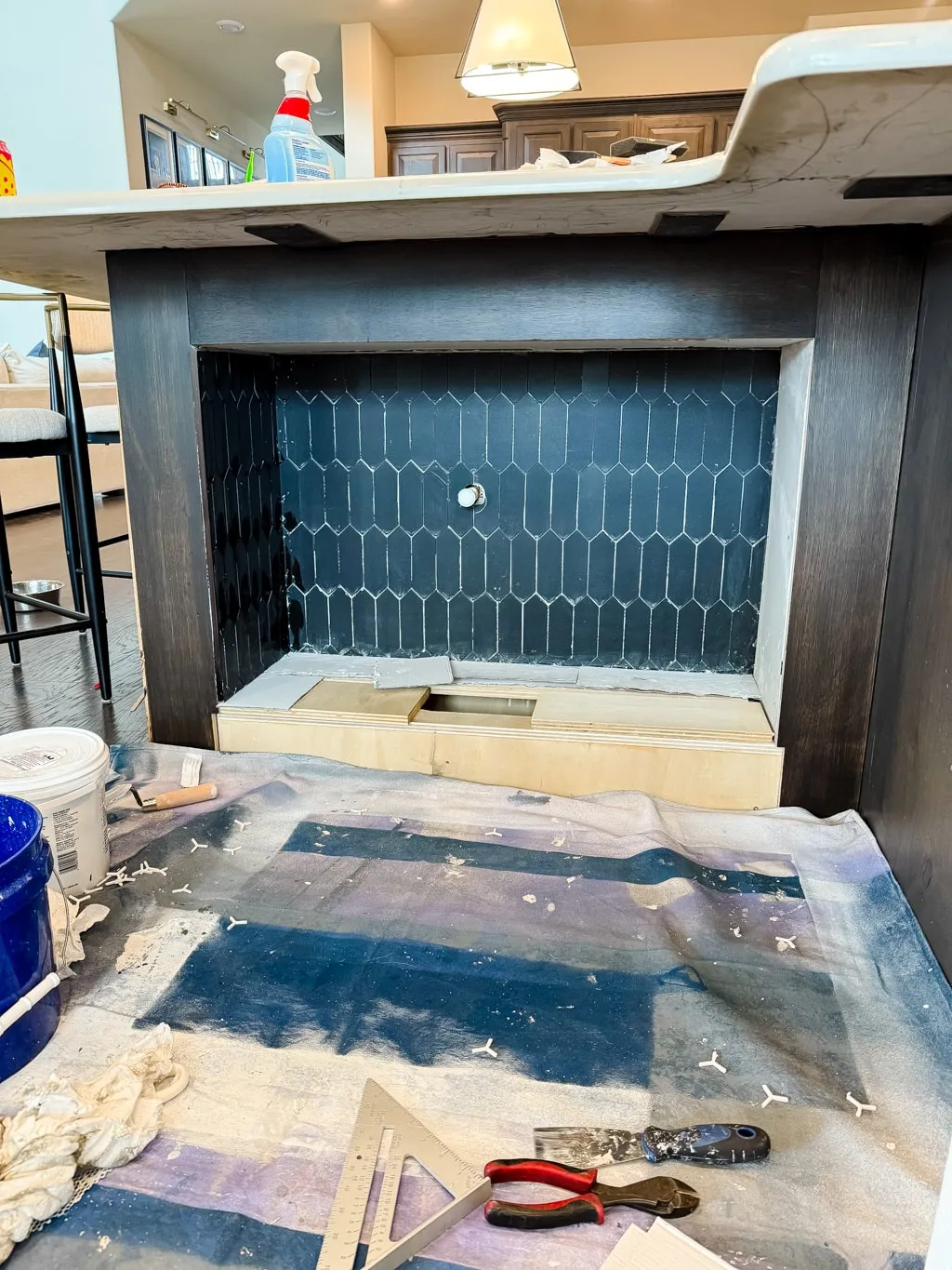 Grouting the installed tiles