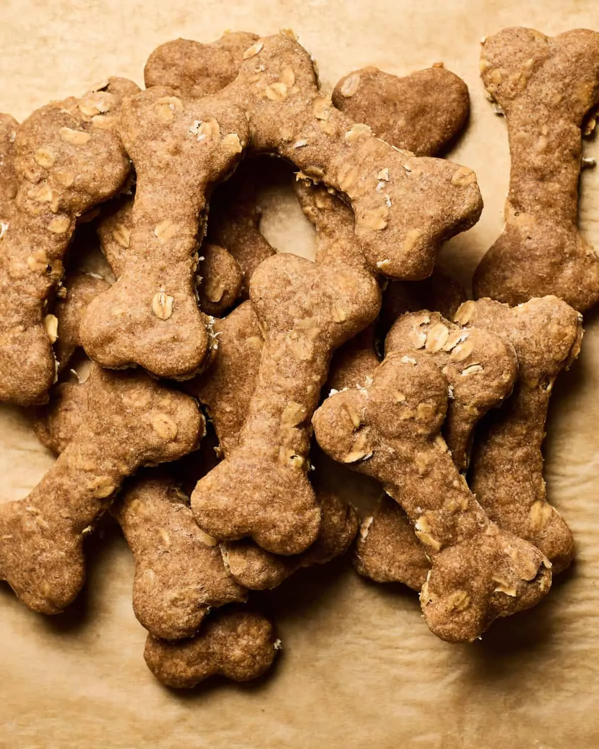 Homemade Dog Treats arranged on parchment paper.