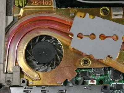 Image of a heat sink and fan inside a laptop