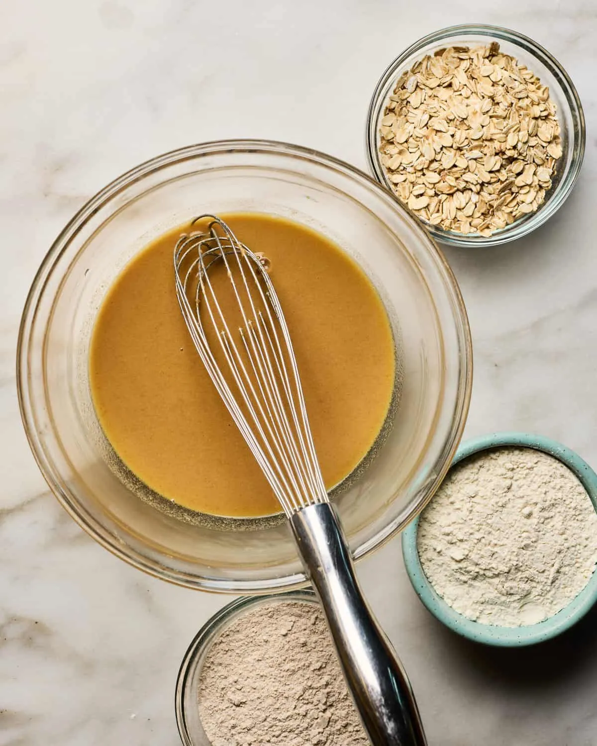 Ingredients being mixed together in a large bowl.