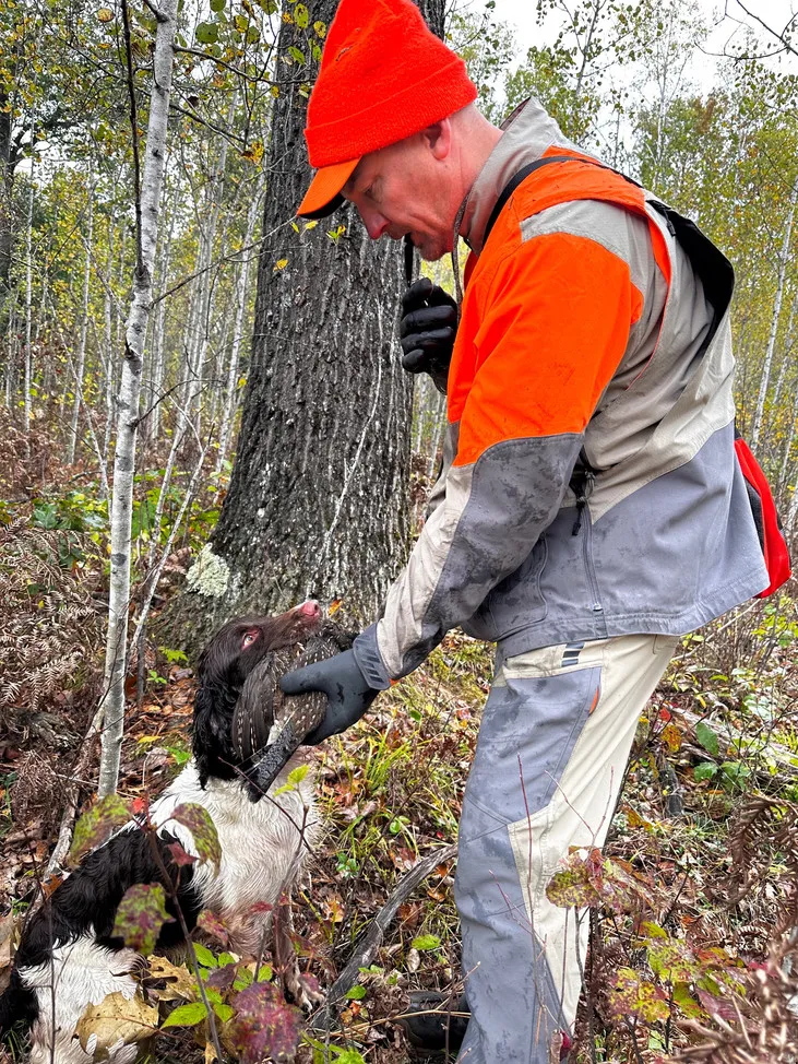 Jeff and Frasier, a dedicated hunter and his spaniel, posing together after a successful hunt.