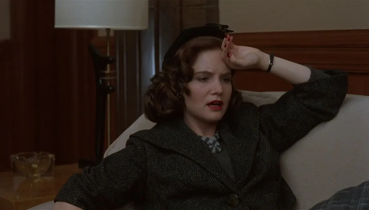 Jennifer Jason Leigh in a promotional shot for a film, possibly early in her career, reflecting her youthful acting phase.