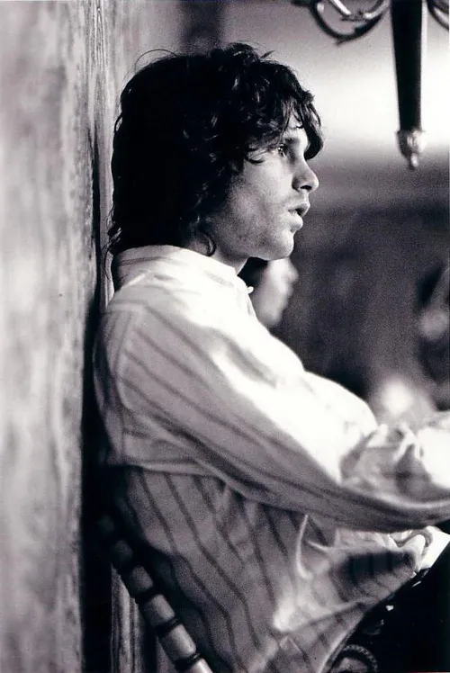 Jim Morrison, inspired by Elvis Presley's stage presence and black leather attire