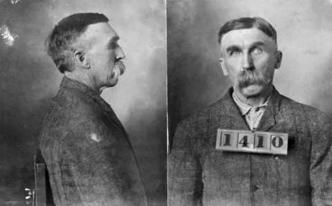 John "Posey" Ryan, aged 61, at the time he was imprisoned on a second-degree murder conviction for killing his wife, Mary Ellen Clouser Ryan and her daughter, Nellie, August 1909. Wyoming Frontier Prison.