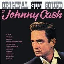 Johnny Cash in a promotional shot for Sun Records, showcasing his signature all-black attire.