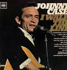 Johnny Cash in a thoughtful pose, perhaps contemplating the next lyric or melody for a song