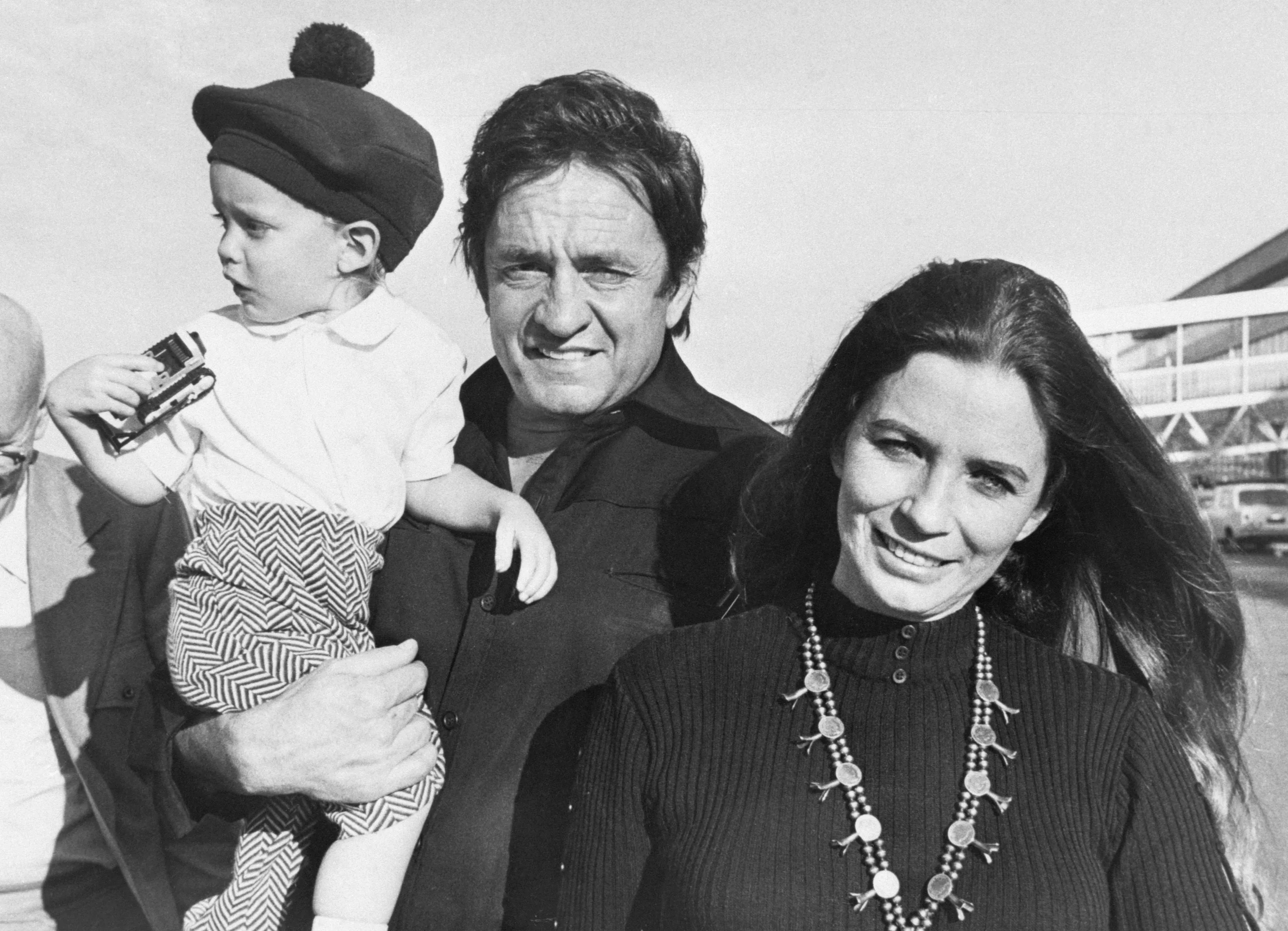 Johnny Cash, June Carter Cash, and their son John Carter Cash