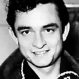 Johnny Cash performing with his guitar