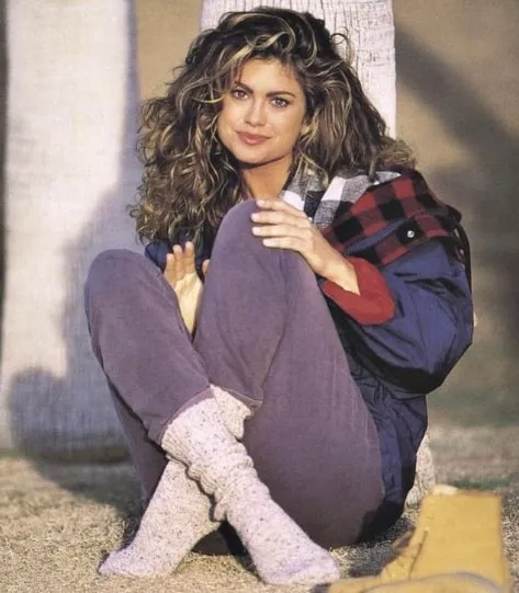 Kathy Ireland, a prominent supermodel from the 1980s and 90s, showcasing a pair of socks, a product that launched her global business empire.