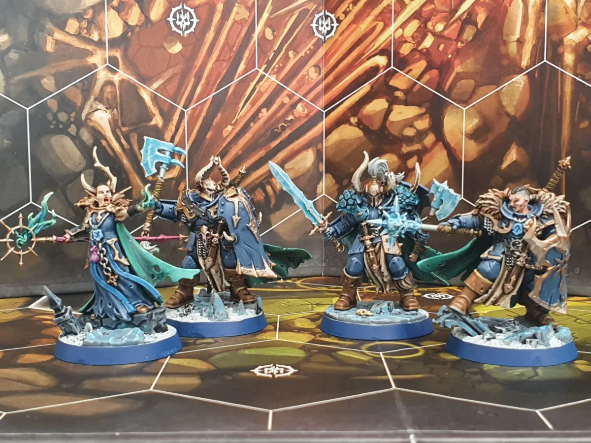 Khagra's Ravagers warband, detailed miniatures painted with grim and menacing features, posed for action