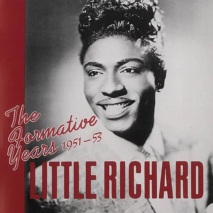 Little Richard at a microphone with a band, likely from his early career
