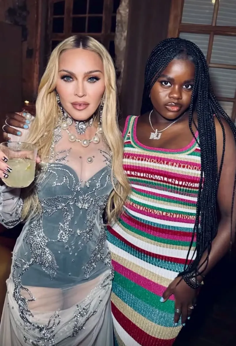 Madonna embracing Mercy James