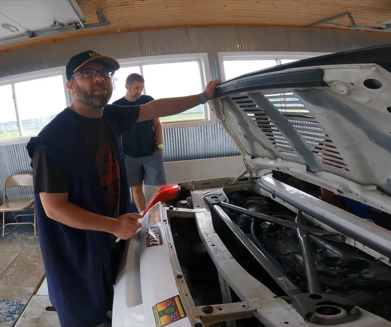 Marc Labranche inspecting the 2AR-FXE engine swap in his Toyota MR2 Tonya, ready for racing.