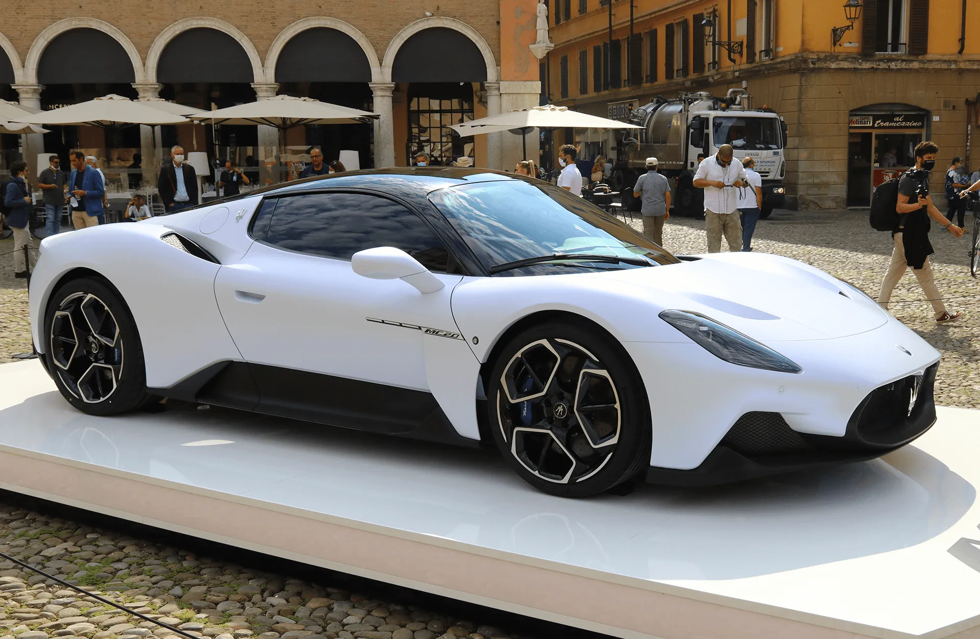 Maserati MC20 presented at a public event, highlighting its sleek design and branding
