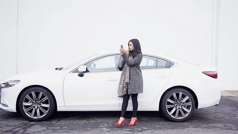 Mazda 6 Signature showcasing its sleek exterior design and elegant stance on a road