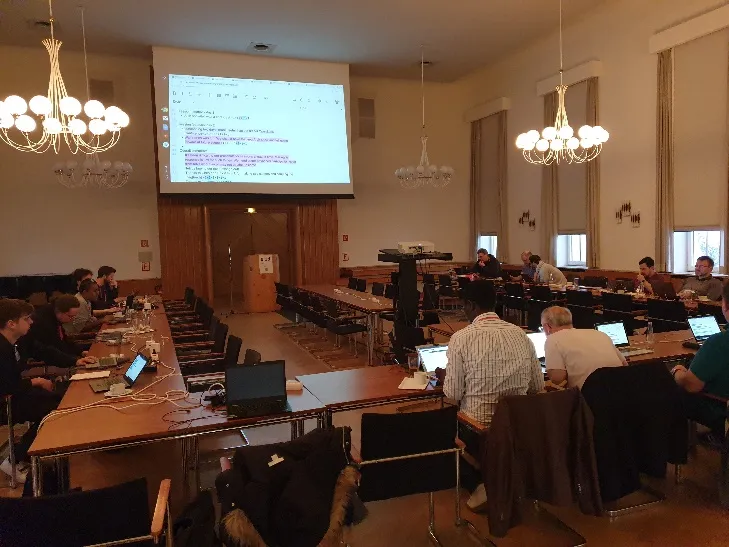 OpenStack operators networking and discussing during a coffee break at the Berlin meetup