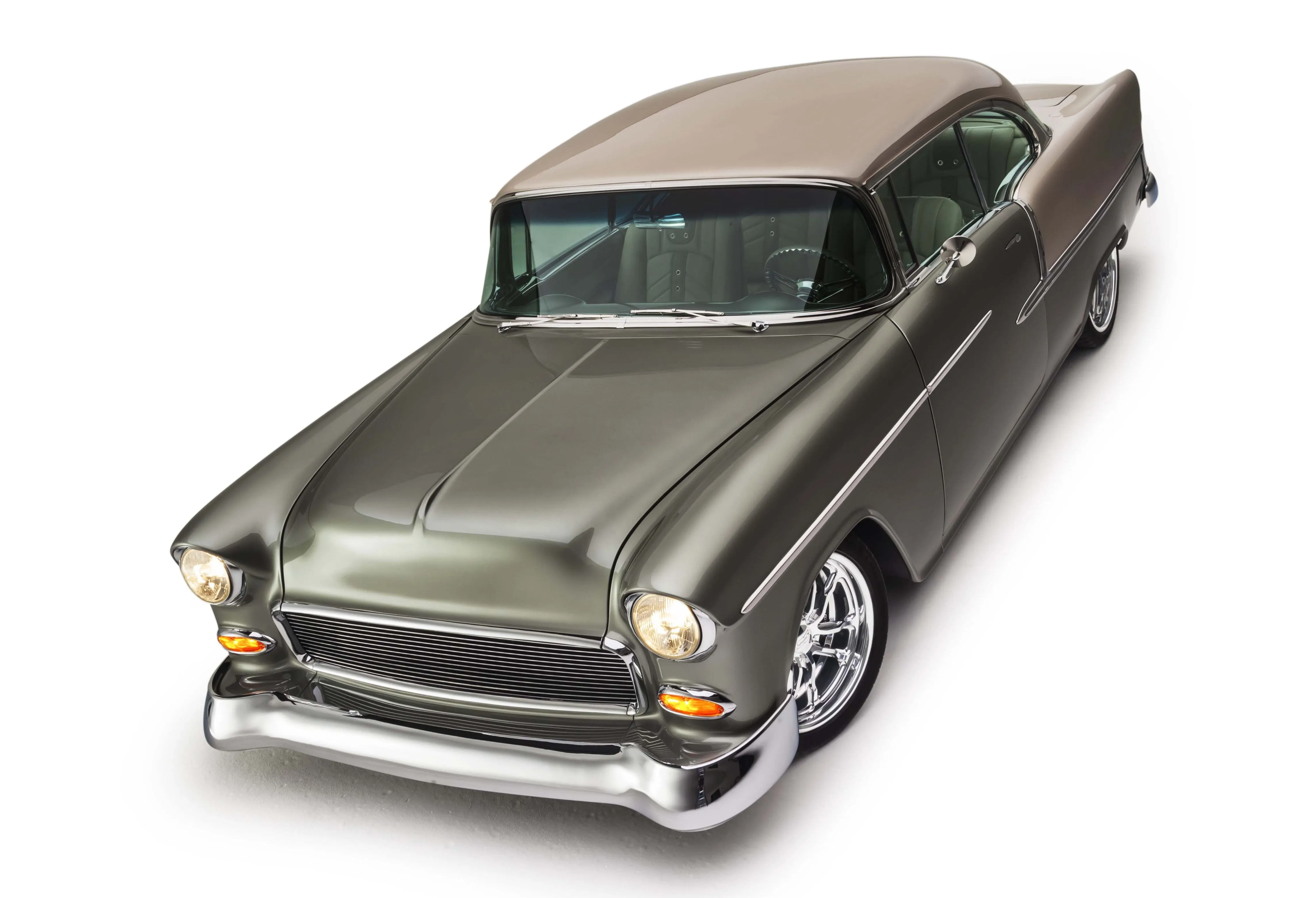 Overhead view of Bob Morgan's customized 1955 Chevy Bel Air, showcasing its sleek silver moss metallic and cashmere sandstone paint job