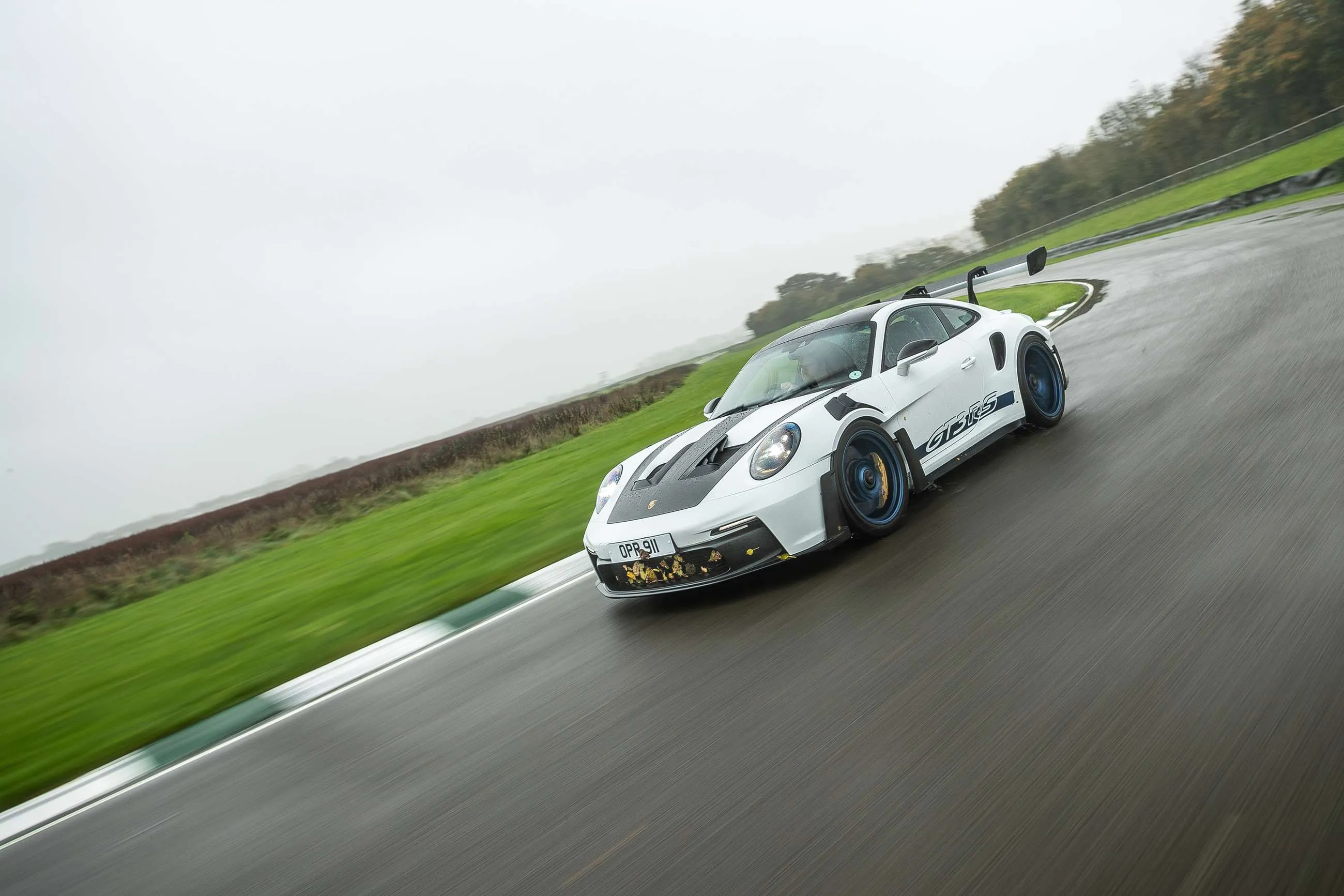 Porsche 911 GT3 RS with massive active rear wing on track
