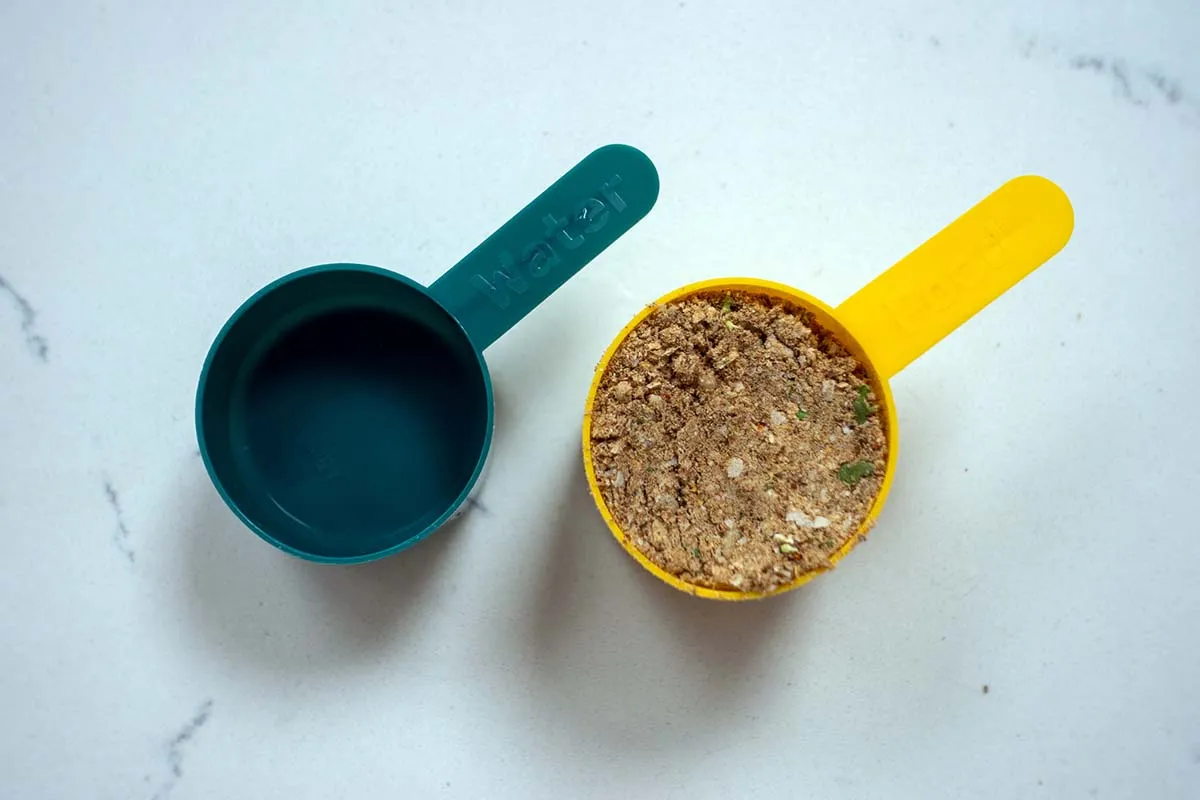 Purepet dog food and a scooper, illustrating easy storage and portioning