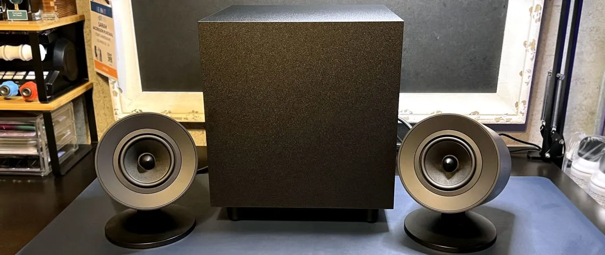 Razer Nommo V2 gaming speakers with a subwoofer on a desk.