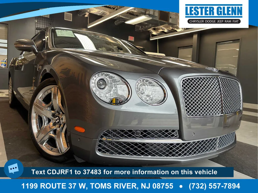 Rear three-quarter view of a gray 2014 Bentley Flying Spur W12, highlighting its elegant design