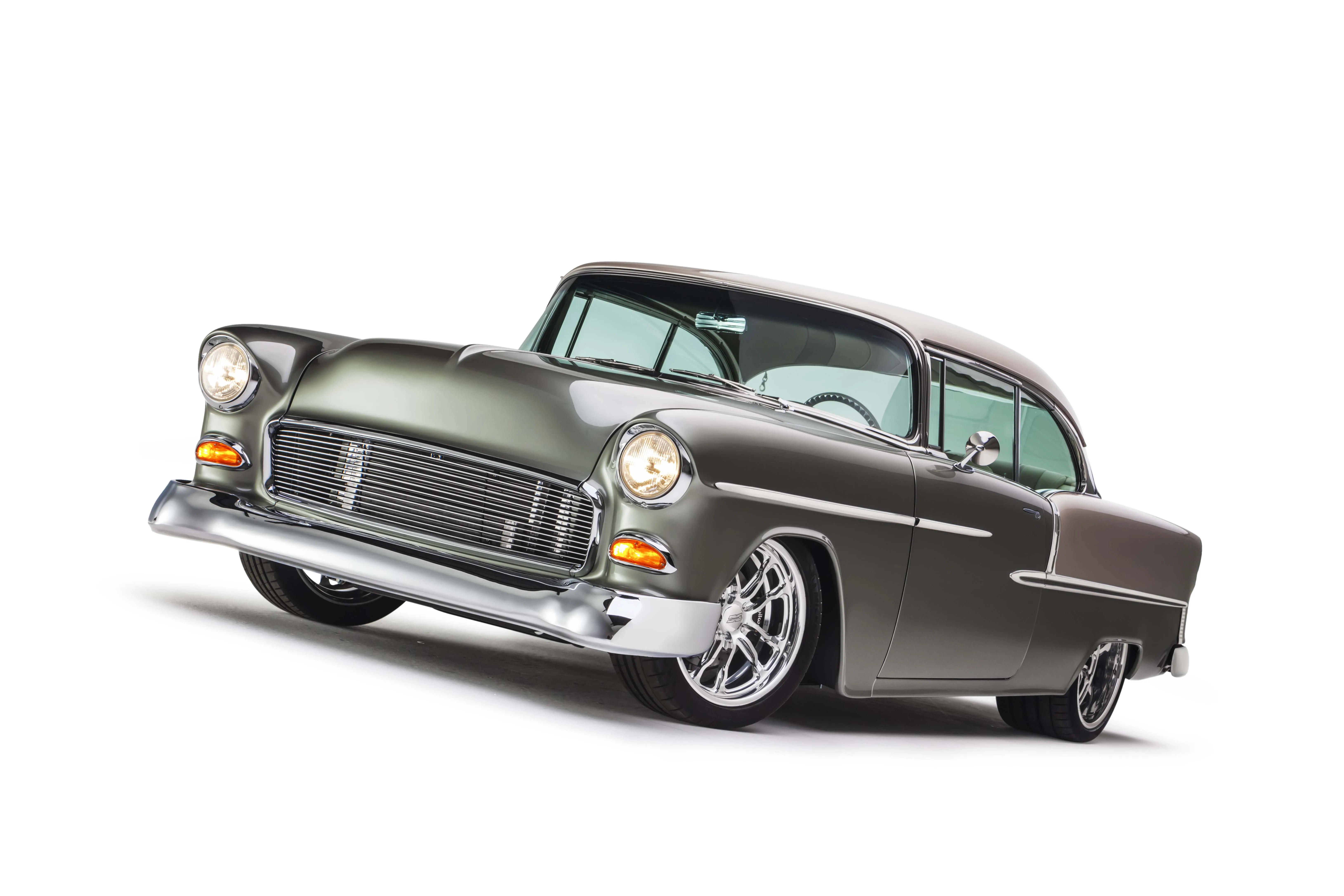 Rear three-quarter view of the extensively customized 1955 Chevy Bel Air, showcasing its modern yet classic appeal