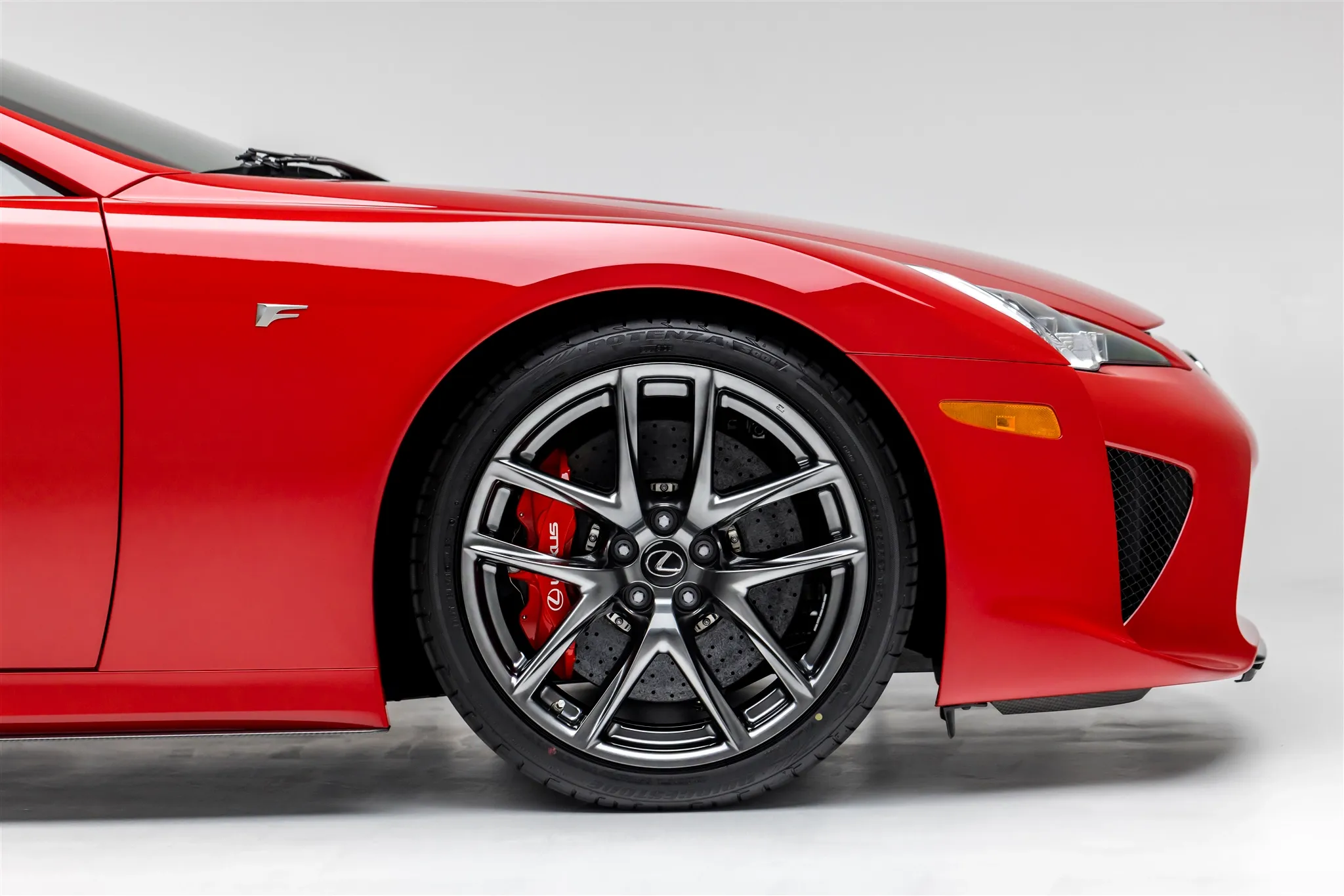 Rear three-quarter view of the Lexus LFA, highlighting its distinctive exhaust and taillight design