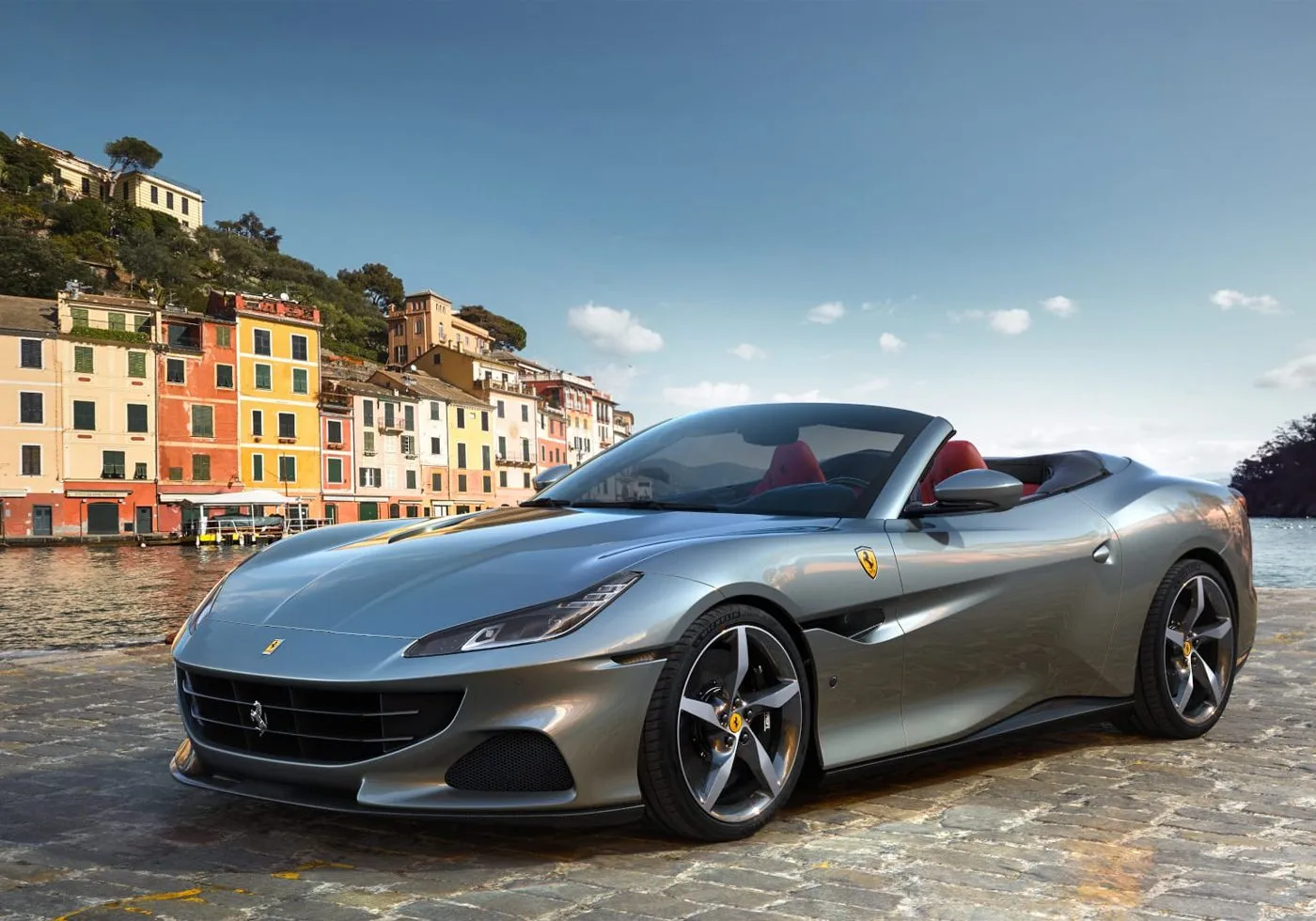 Red Ferrari supercar with iconic prancing horse badge parked outdoors