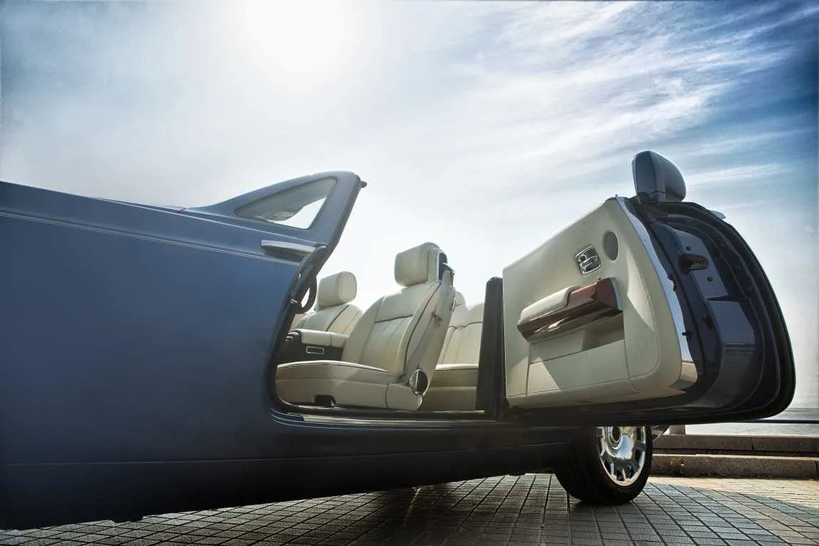 Rolls-Royce Boat Tail convertible with door open, showcasing its luxurious interior