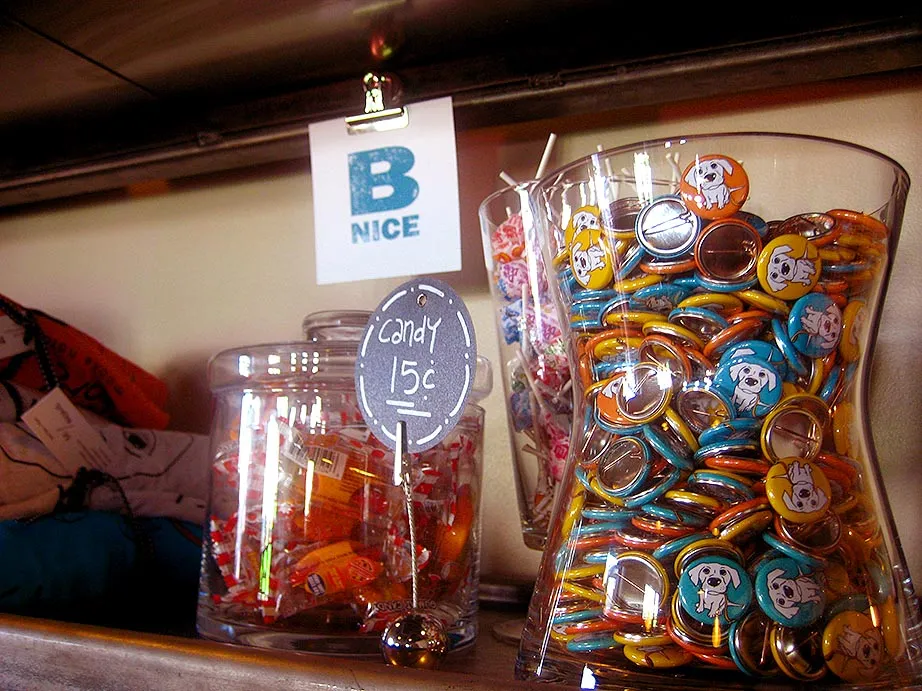 Short Leash merchandise display including dog-themed apparel