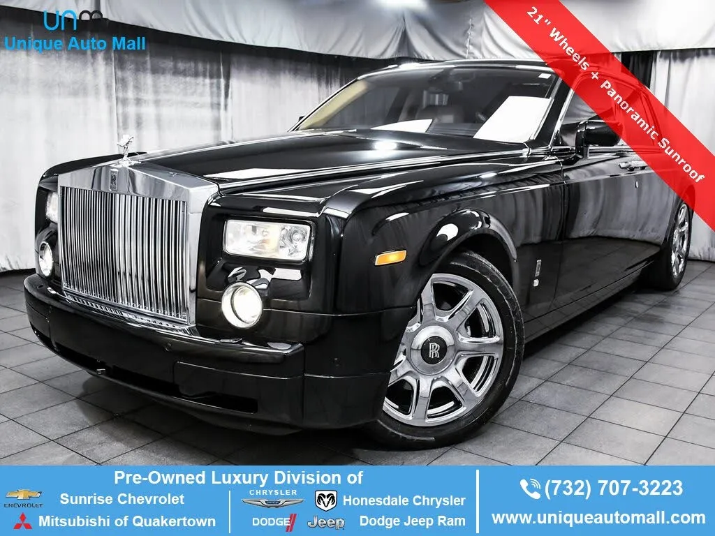 Side profile of a 2009 Rolls-Royce Phantom in Black, highlighting its elongated design and coach doors