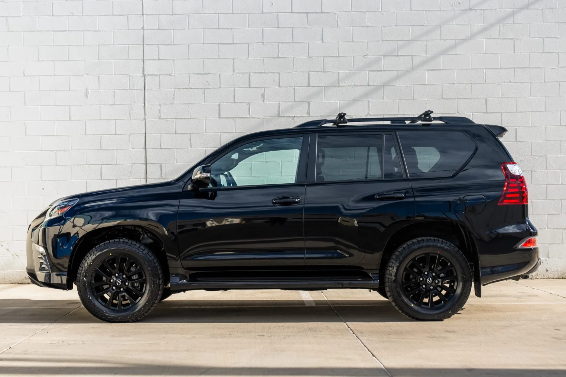 Side profile of the 2022 Lexus GX460 Black Line Special Edition showcasing roof rails and black trim