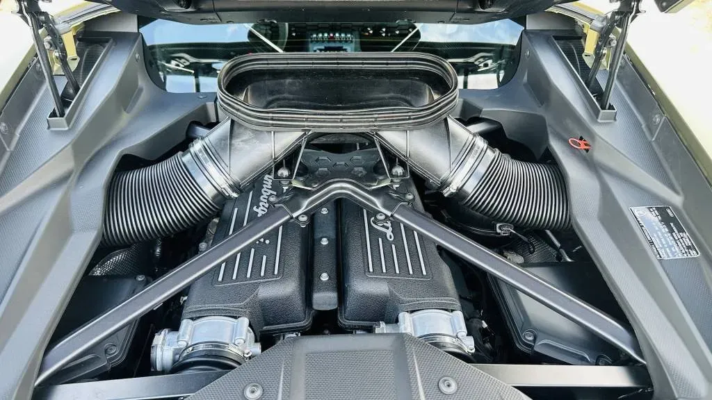 Side profile of the 2024 Lamborghini Sterrato, highlighting its increased ground clearance, roof rack, and unique wheel arch cladding.