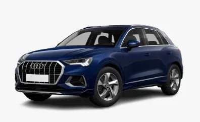 Side view of a white Audi Q3 compact SUV parked on a paved road
