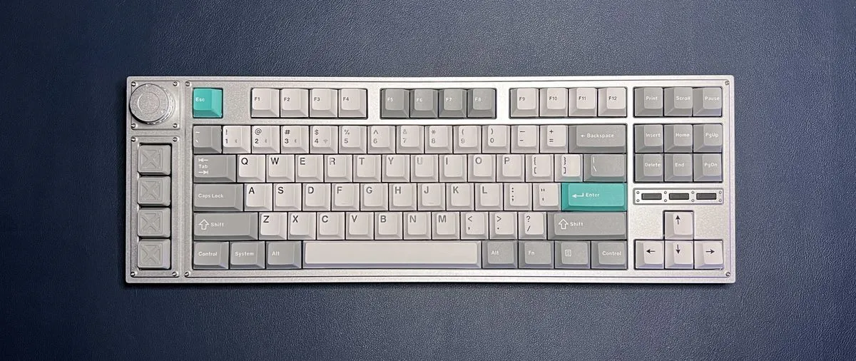 Silver Lemokey L3 TKL gaming keyboard on blue mat