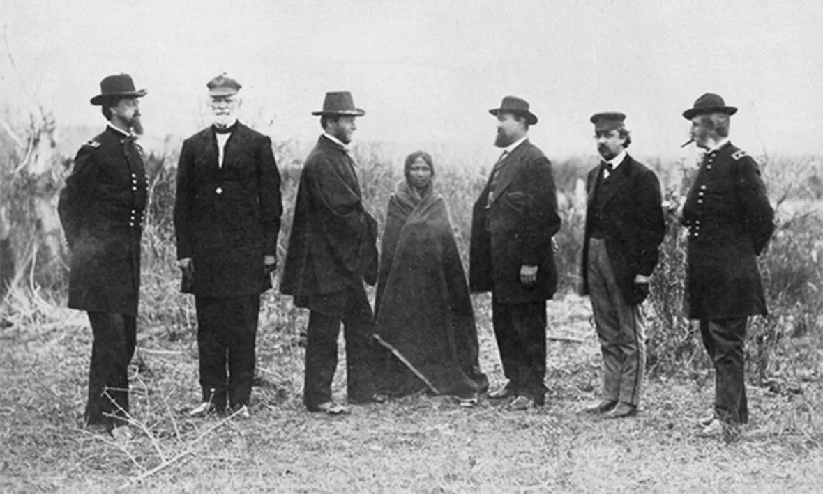 Sophia Mousseau, center, daughter of a French-speaking trader and an Oglala woman, was a girl when she interpreted for the peace commissioners at the Fort Laramie Treaty of 1868. By 1876 she was the common-law wife of Posey Ryan; together they had five children before he left her for Mary Ellen Clouser.