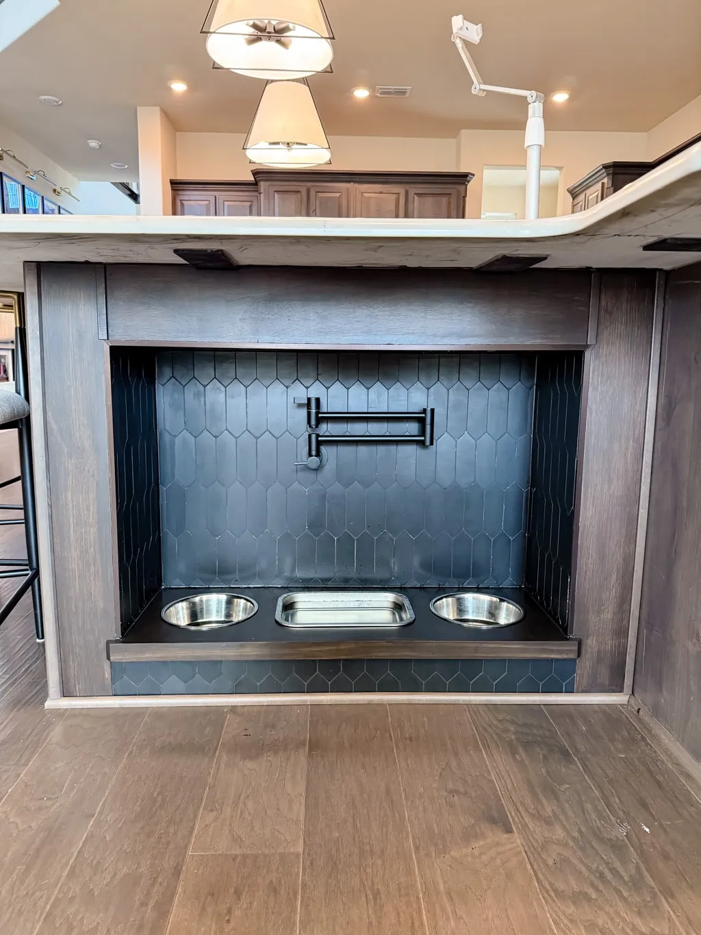 Stainless steel bowls placed in frame slots