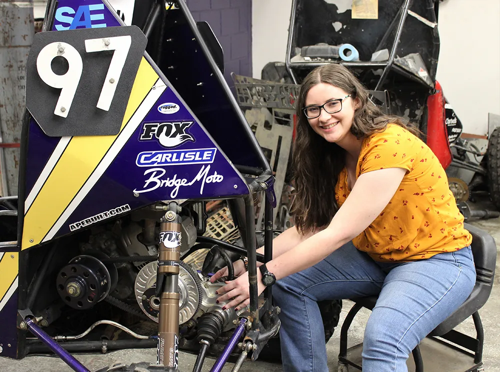 Students working on Baja SAE car