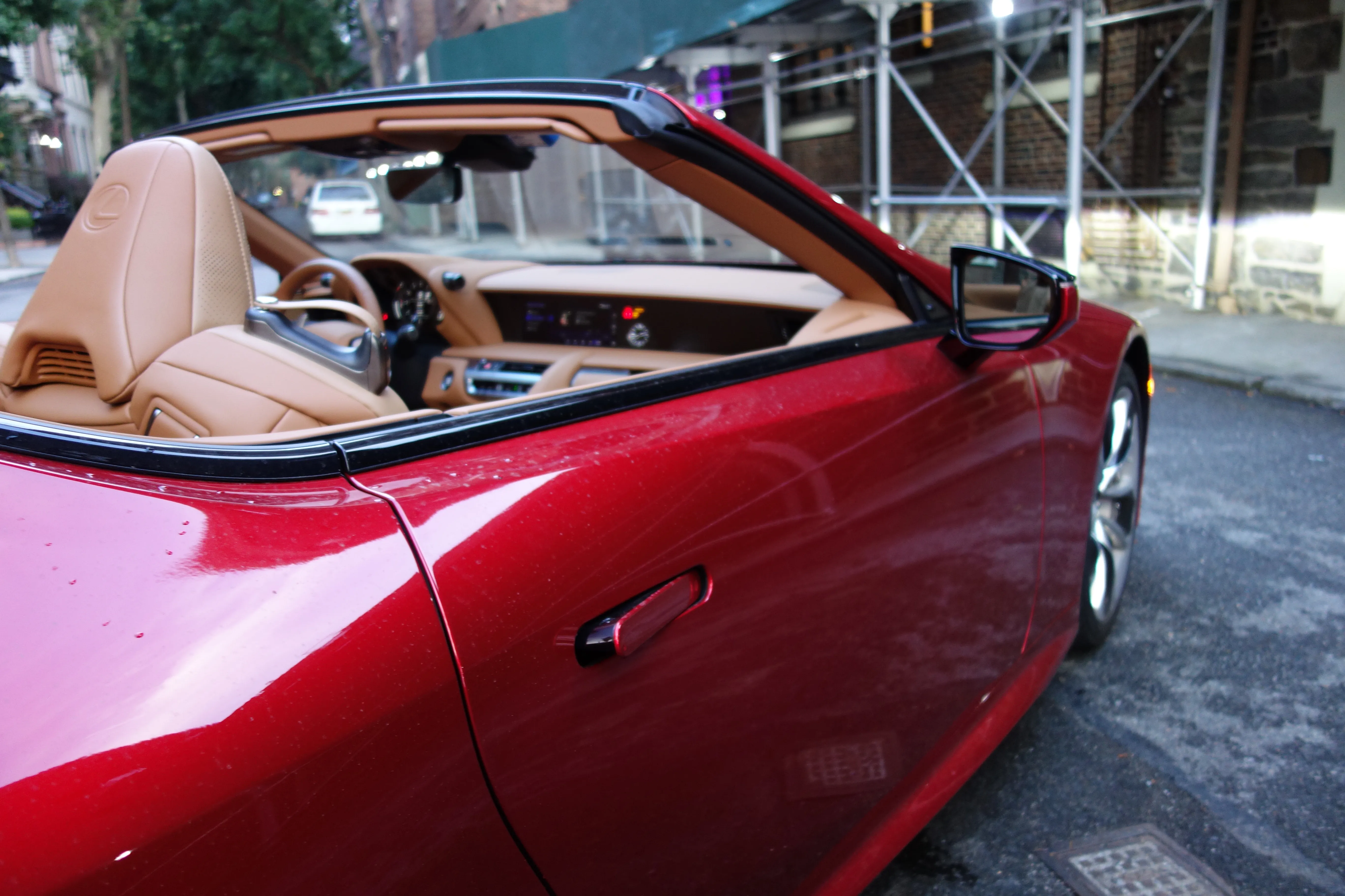 The 2021 Lexus LC 500 Convertible showcases its bold, distinctive design with the soft top down