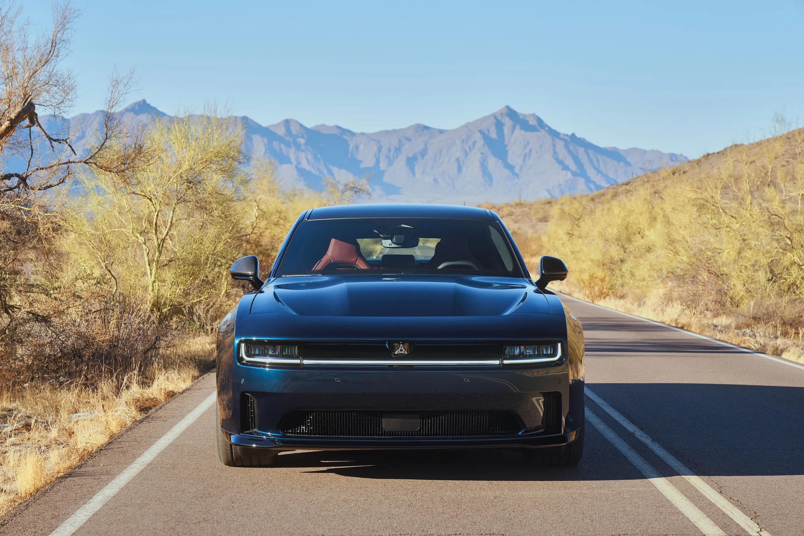 The 2024 Dodge Charger SRT Daytona Scat Pack in dynamic action on the track