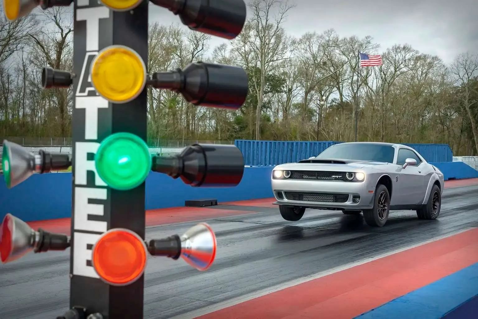 The aggressive stance of the Dodge Challenger SRT Demon 170, highlighting its wide tires and drag-strip readiness.