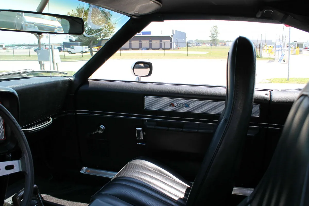 The distinctive front-side profile of the 1973 AMC Javelin AMX, highlighting its aggressive styling.