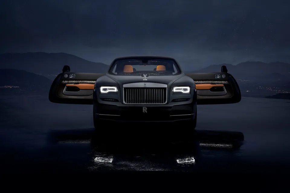 The elegant profile of a Rolls-Royce Wraith, emphasizing its grand tourer design and powerful stance